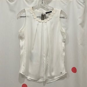 White Dress Top by Tommy Hilfiger. Pretty flower appliqué on collar. Size Small